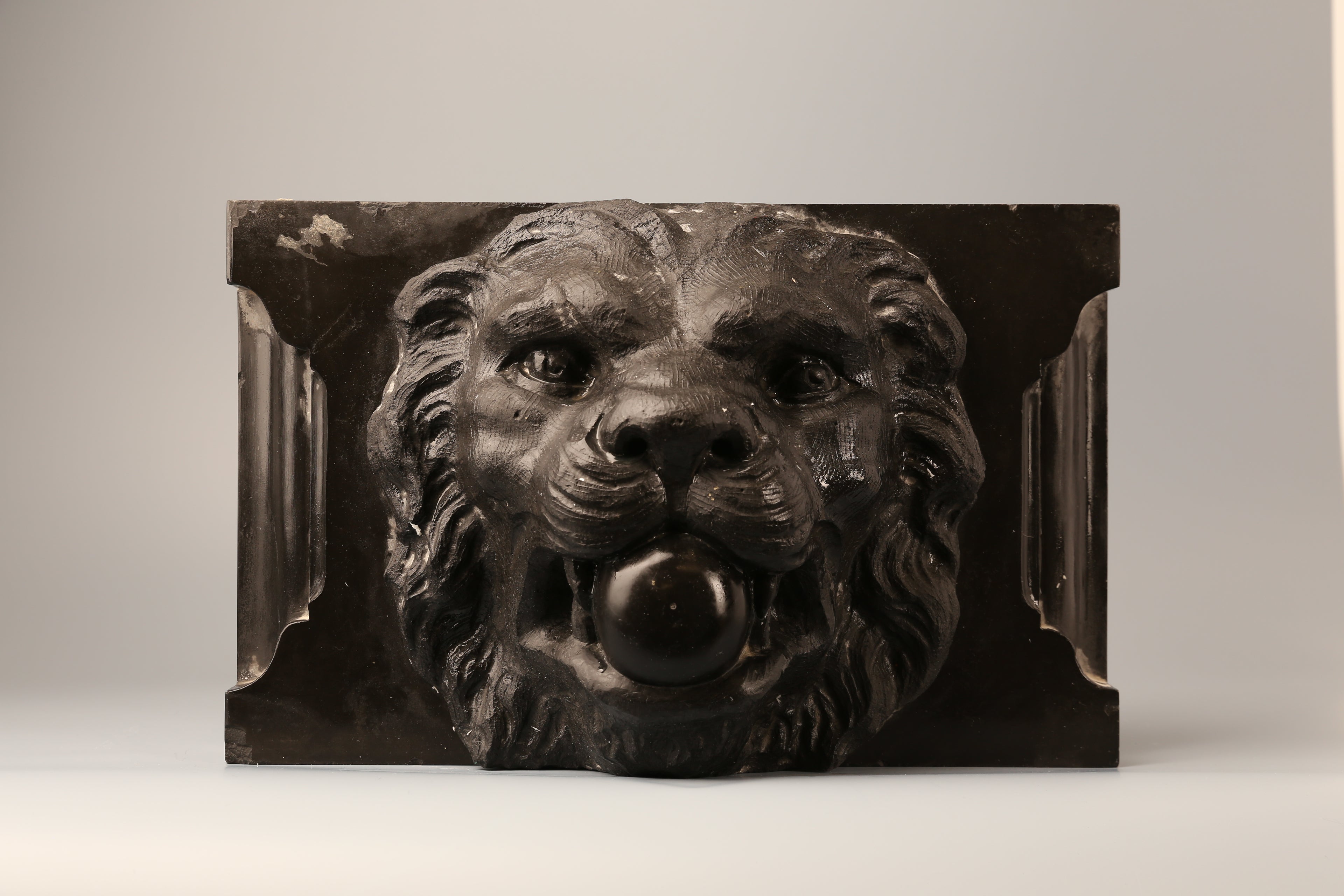 Pair of Belgian marble lion faces