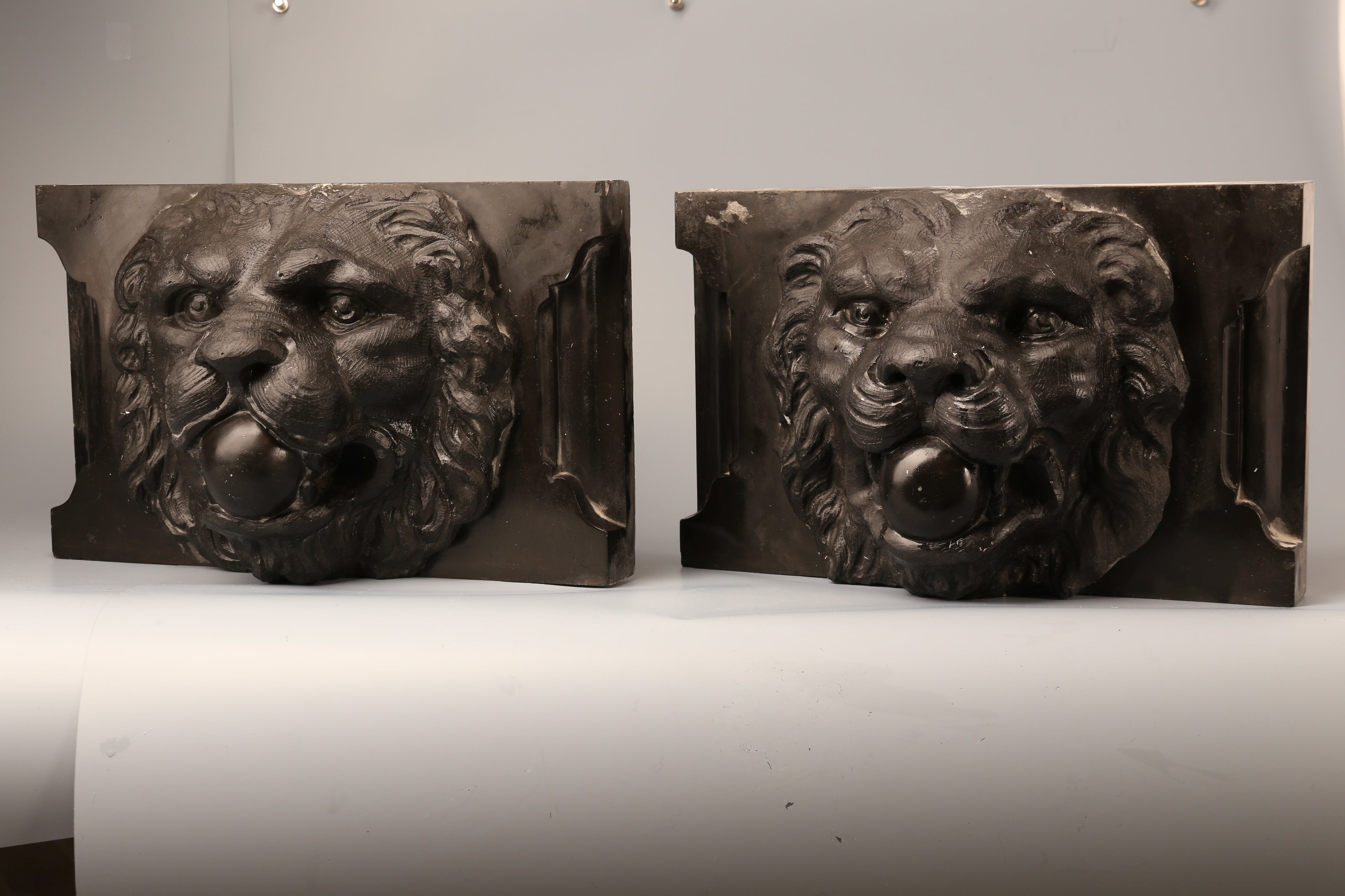 Pair of Belgian marble lion faces