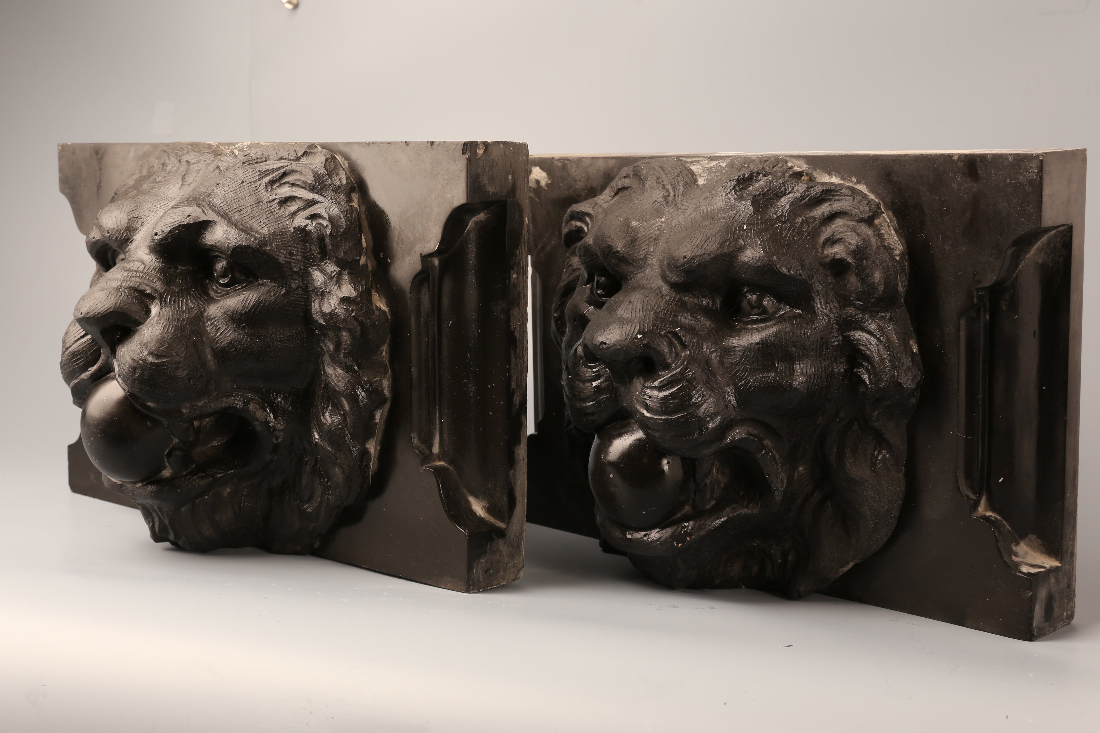 Pair of Belgian marble lion faces