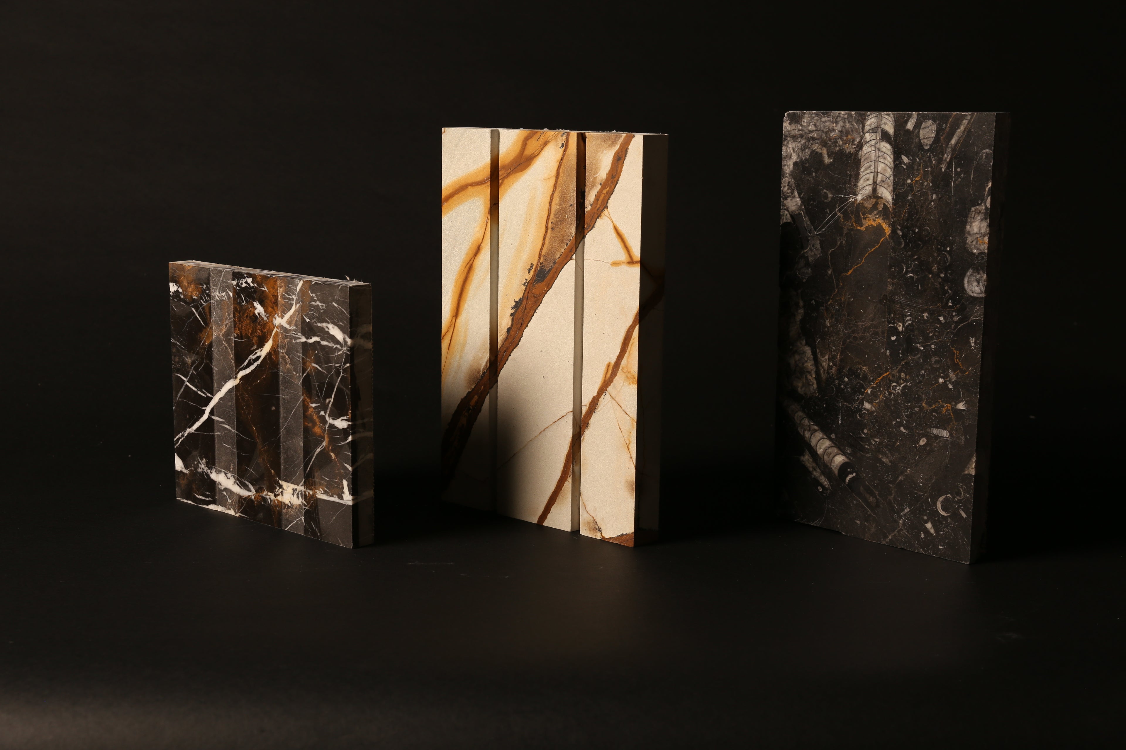 A set of three contemporary marble sculptures