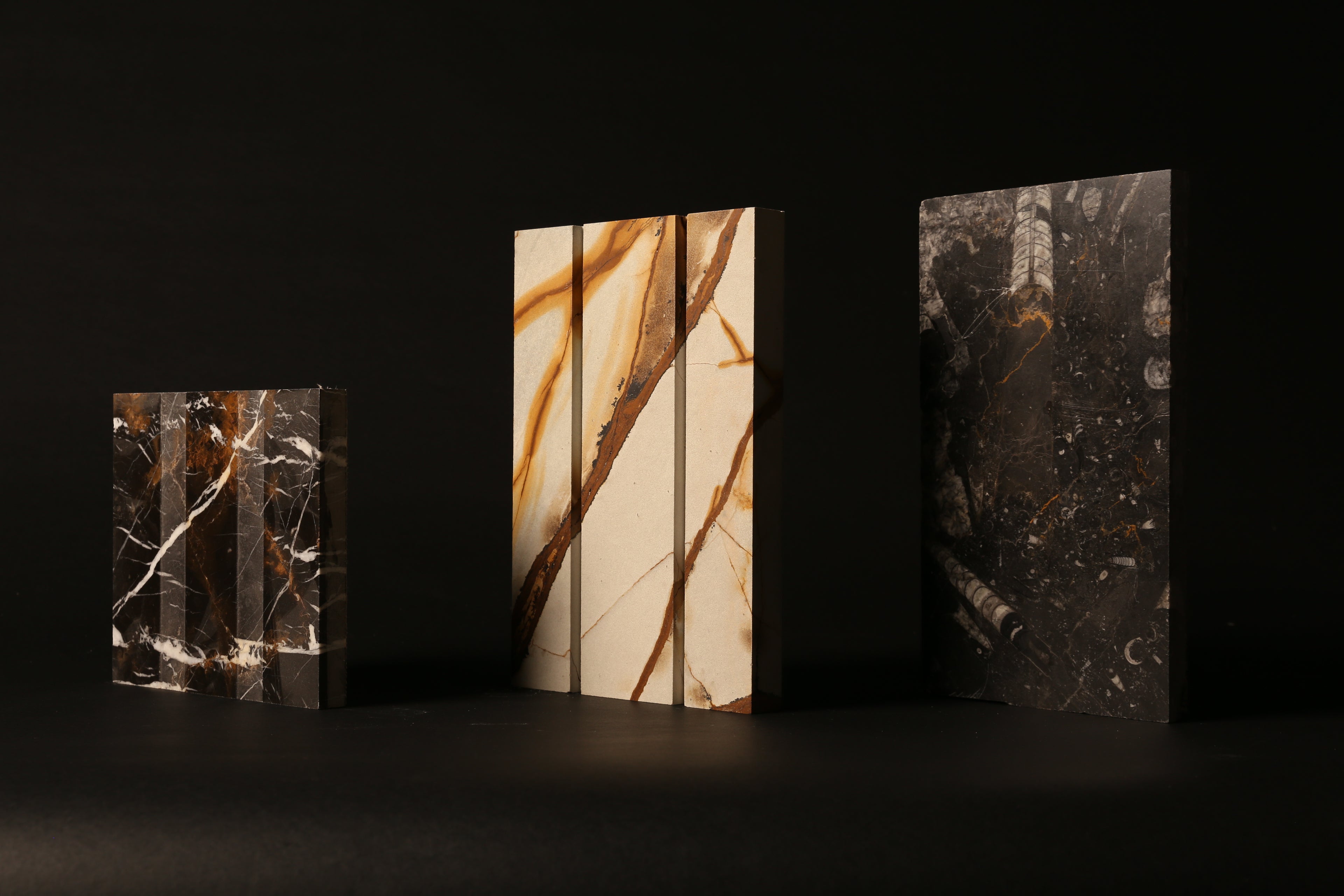 A set of three contemporary marble sculptures