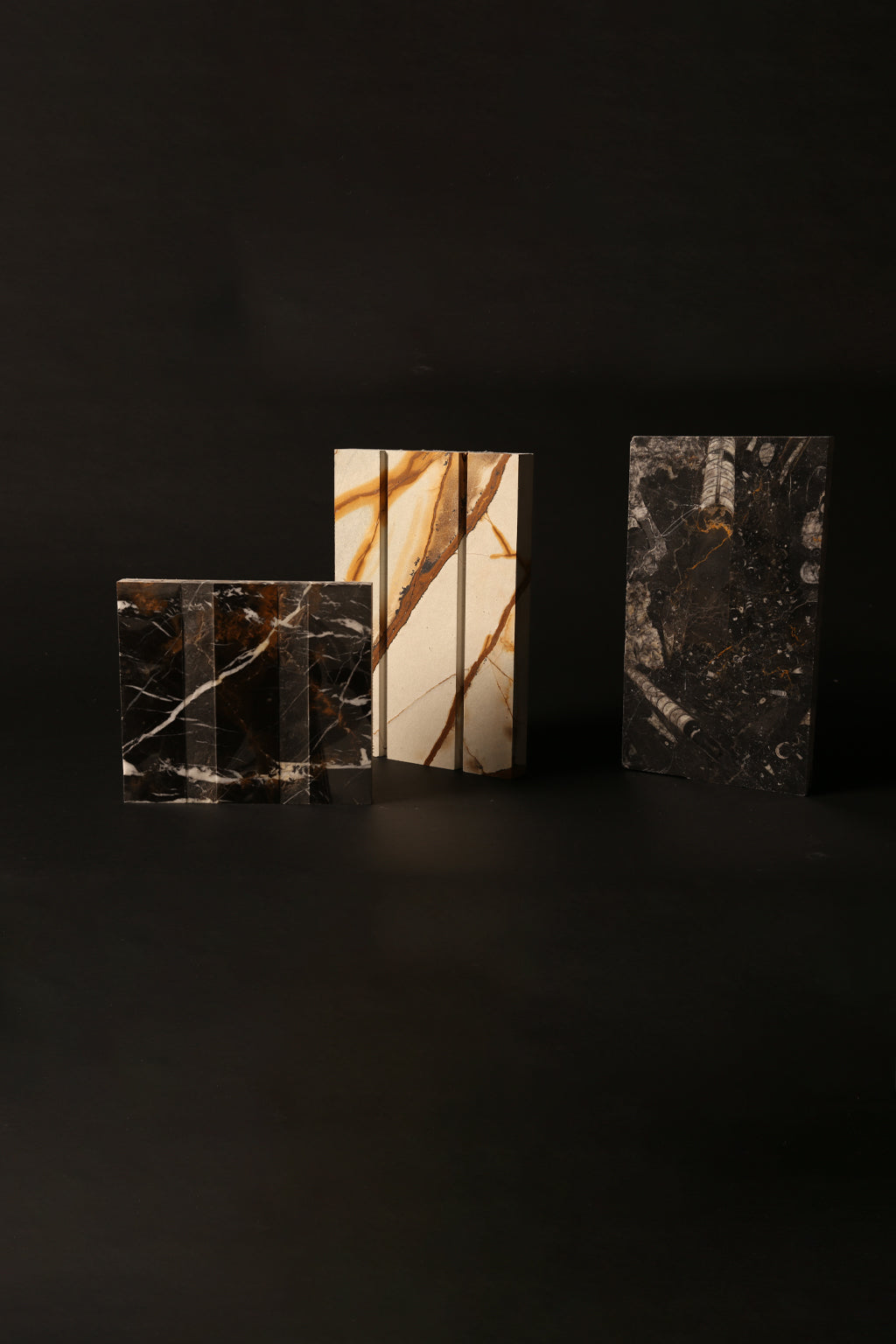 A set of three contemporary marble sculptures